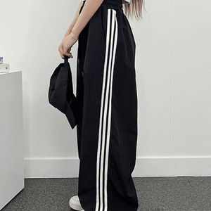 Three-line rustling track pants
