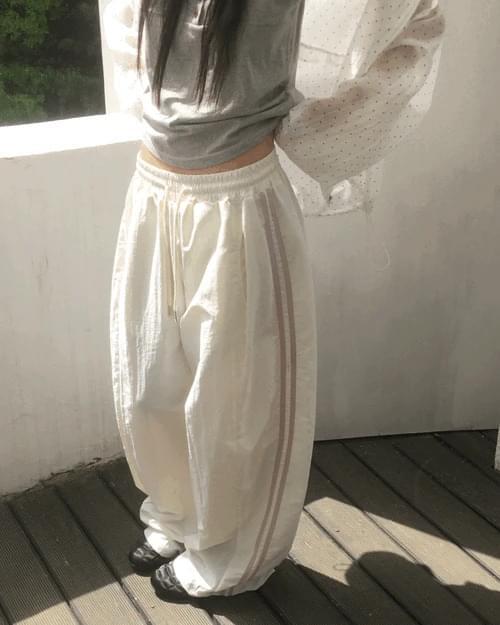 네오트 사이드 트랙 배색 나일론 팬츠